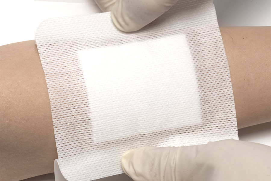 Is the wound dressing made from hypoallergenic materials, and what testing has been done to ensure it is safe for sensitive skin?